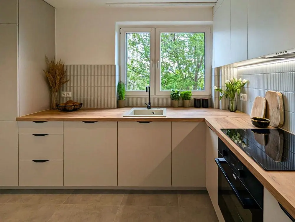 Bright custom kitchen with a wooden worktop