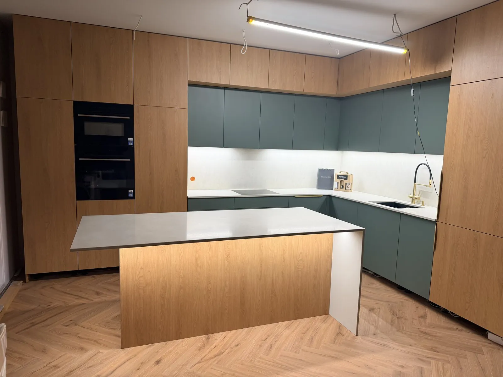 Oak and green kitchen with island
