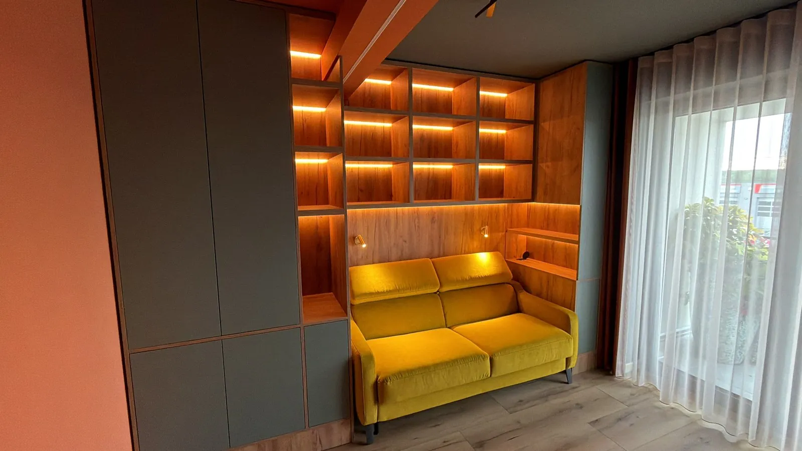 Sofa nook with lit shelving